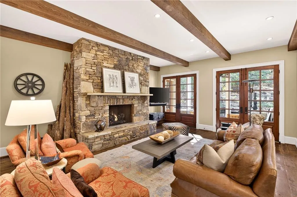 Living area with french doors, hardwood / wood-style floors, a fireplace, and recessed lighting