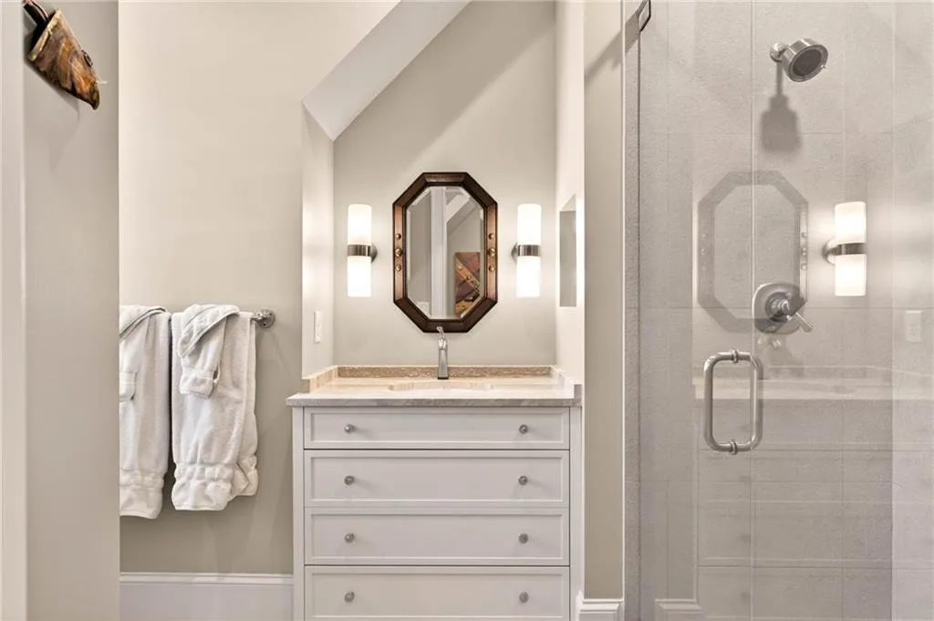 Bathroom with vanity and a stall shower