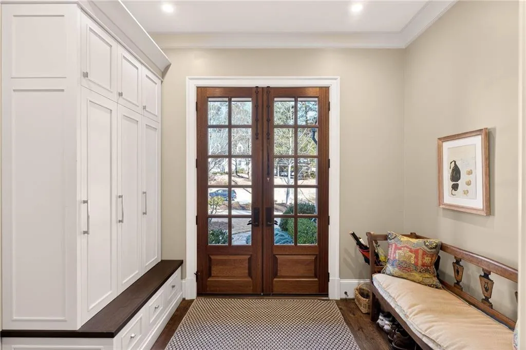 Mudroom with french doors and dark wood-style flooring