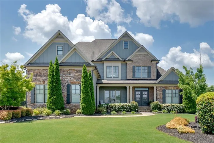 Stone and siding exterior with gabled roof lines
