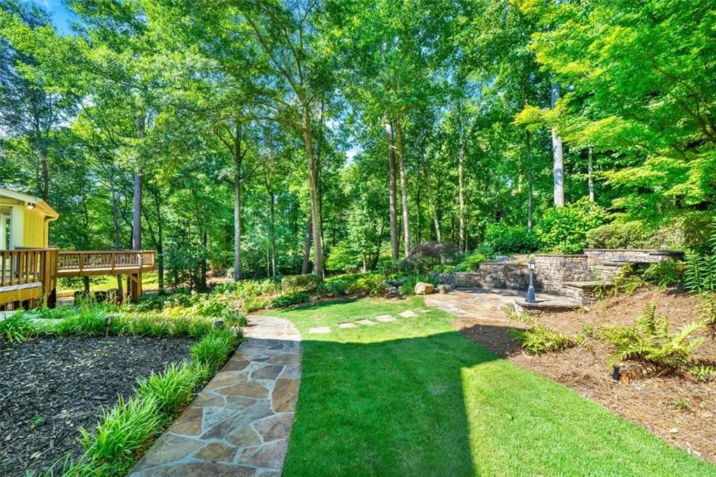 View of yard with a wooden deck