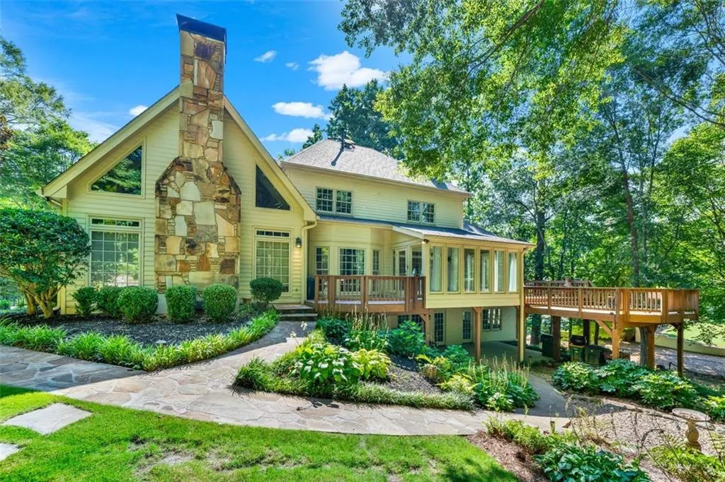 Rear view of property with a deck