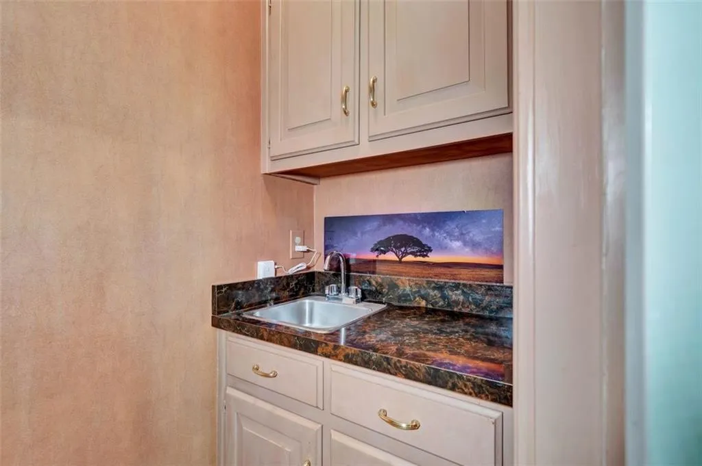 Kitchen with sink and white cabinets