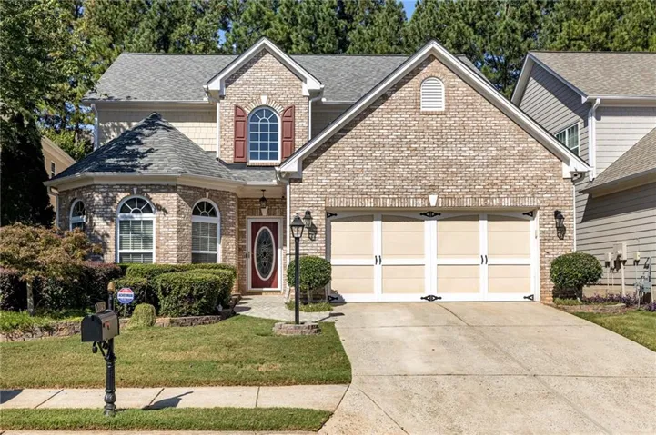 Brick and siding exterior with a multi-gabled roofline