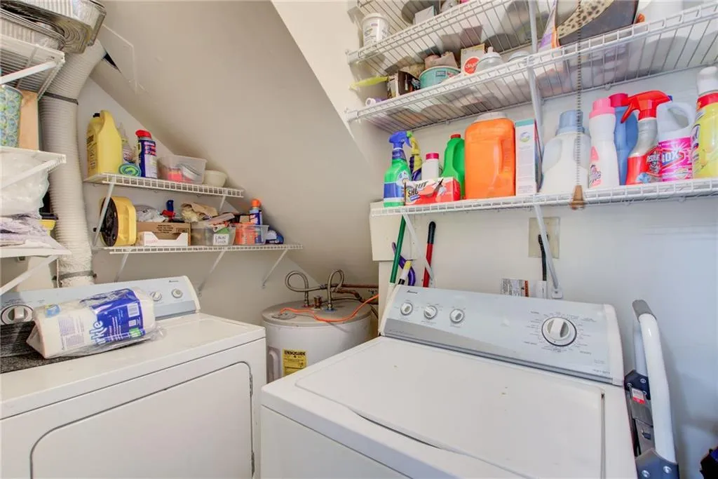 Laundry area with independent washer and dryer and water heater