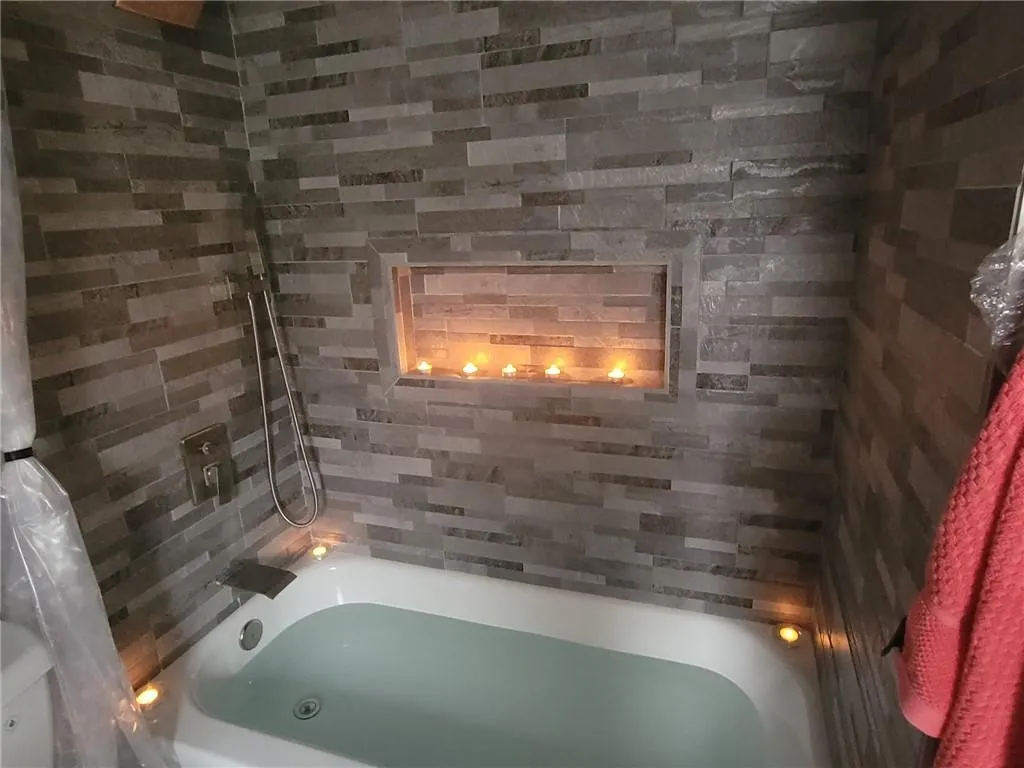 remodeled Primary bath with spa like soaking tub. A true haven!