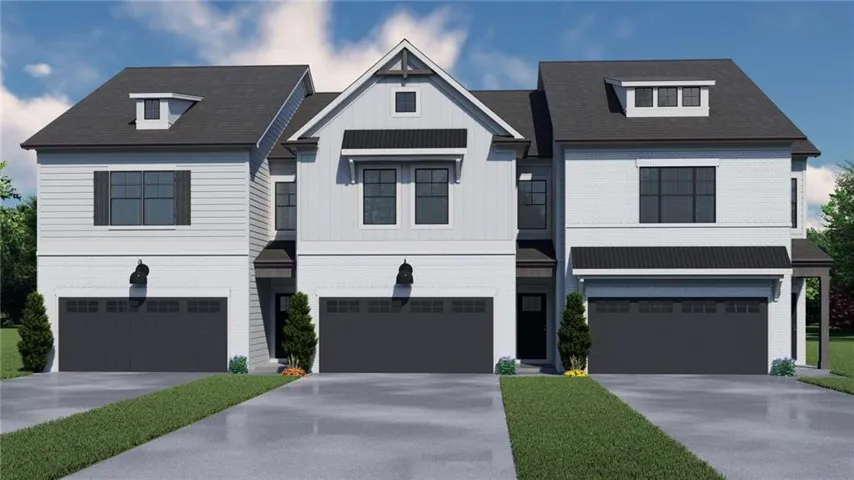 Contemporary townhome exterior featuring light-colored siding and dark trim
