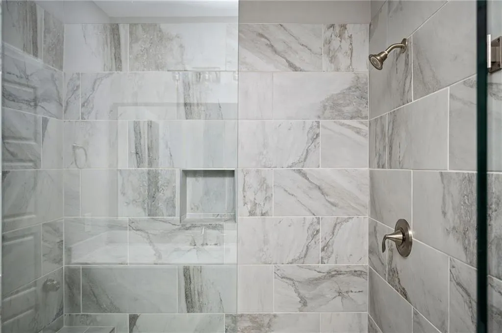 Bathroom view of a tile shower