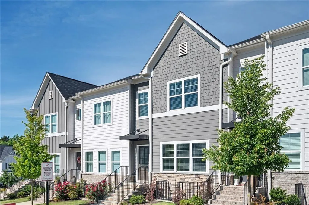 Craftsman-style house featuring board and batten siding and stone siding