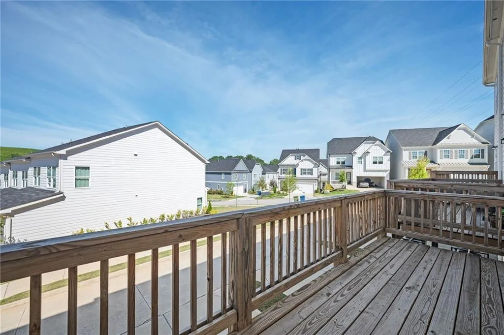 Wooden terrace featuring a residential view