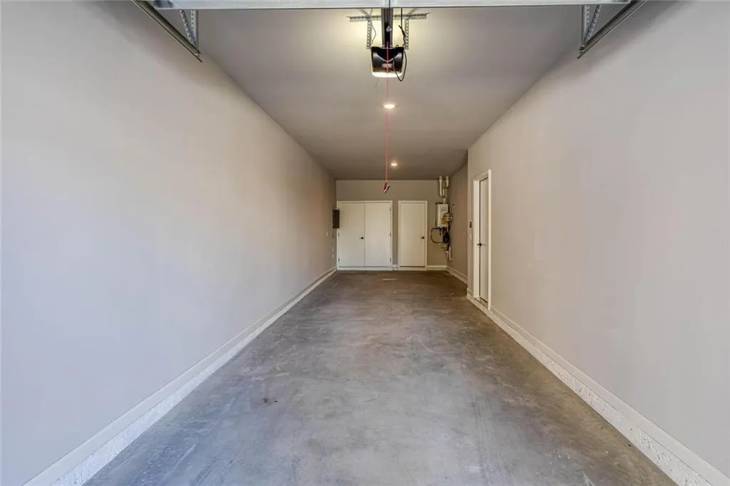 Garage featuring a garage door opener