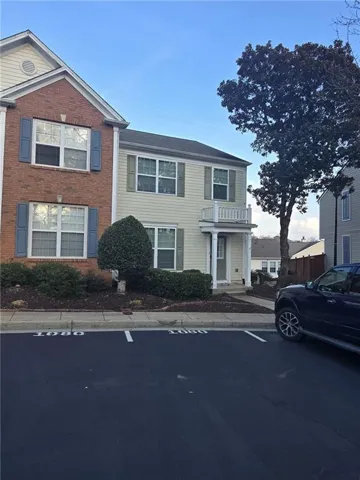 Two-story townhome with brick and siding exterior