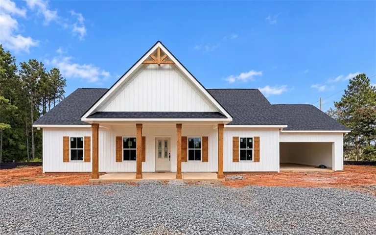 White board and batten exterior with wood accent shutters