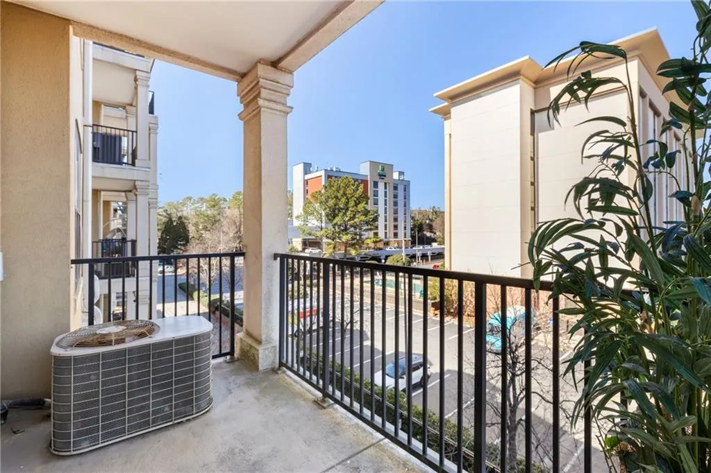 Balcony featuring central AC unit