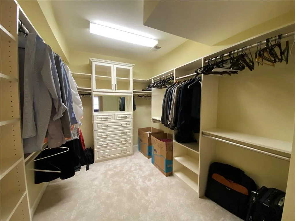 master closet with custom cabinets