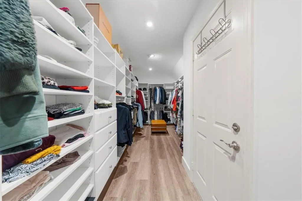 Walk in closet featuring light wood finished floors