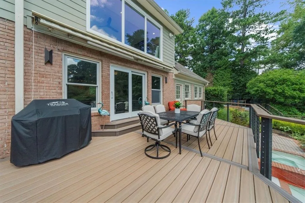 Deck featuring outdoor dining area and area for grilling