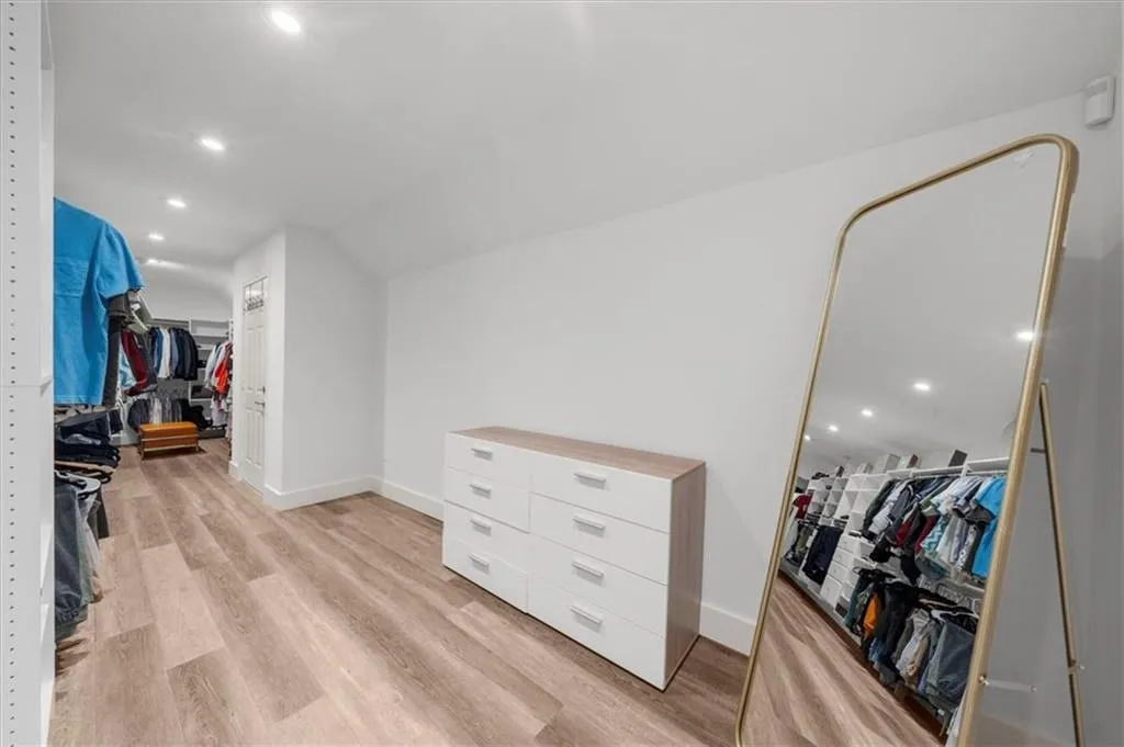 Spacious closet with light wood-style floors