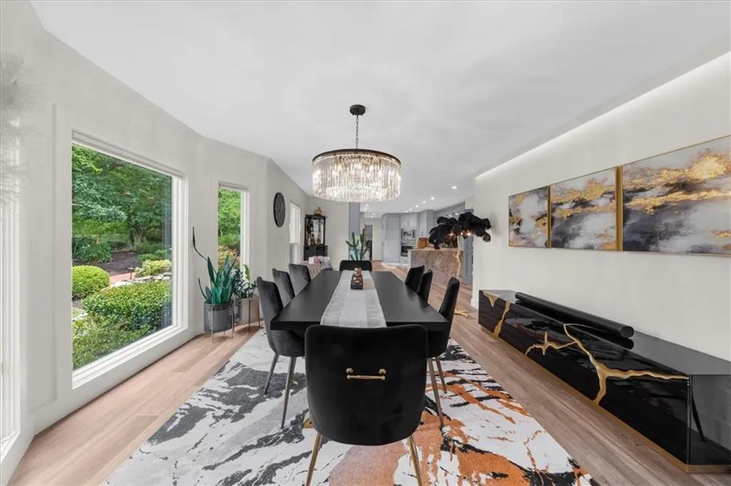 Dining space featuring a chandelier and light wood-type flooring