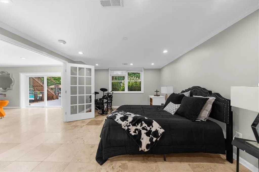 Bedroom featuring crown molding and recessed lighting