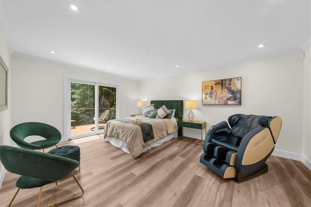 Bedroom featuring access to outside, light wood-type flooring, ornamental molding, and recessed lighting