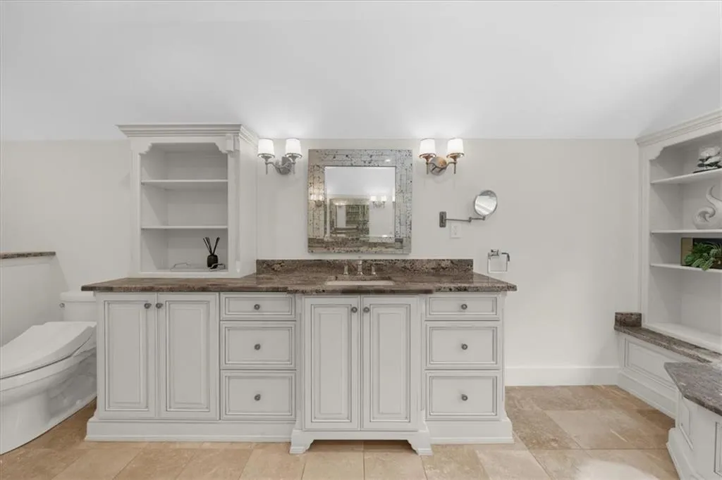 Bathroom featuring vanity and built in features