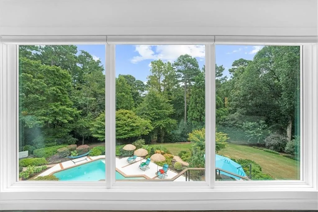 Doorway with healthy amount of natural light and view of scattered trees