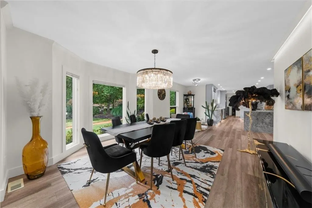 Dining area with a chandelier and light wood finished floors