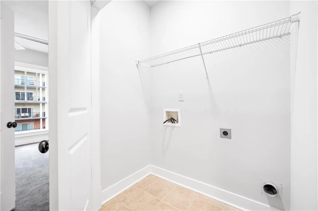 Laundry area with hookup for an electric dryer and hookup for a washing machine
