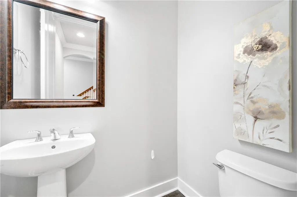 Bathroom featuring crown molding and recessed lighting