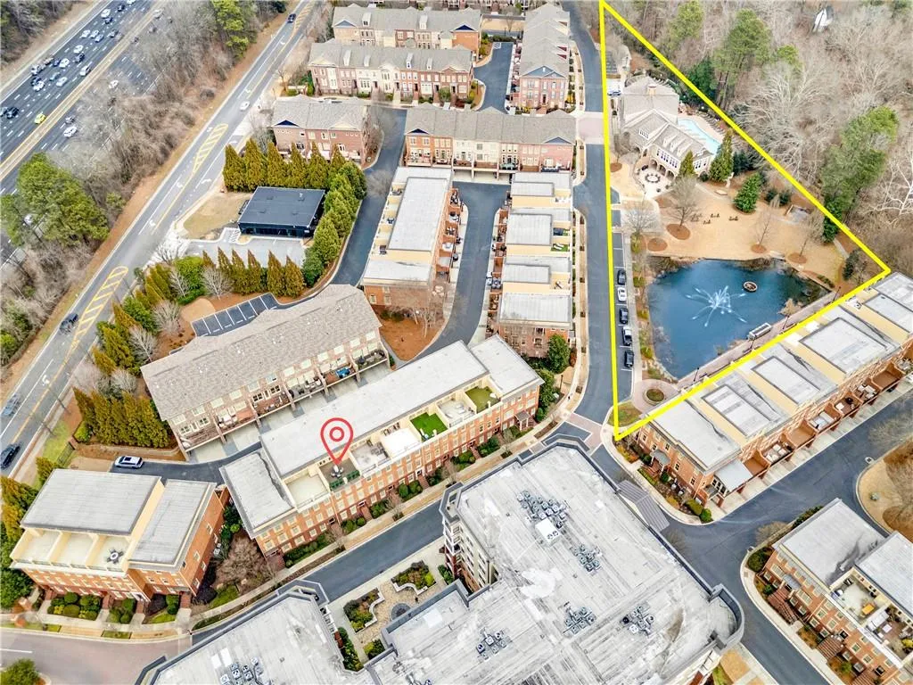 Aerial perspective of suburban area with a large body of water