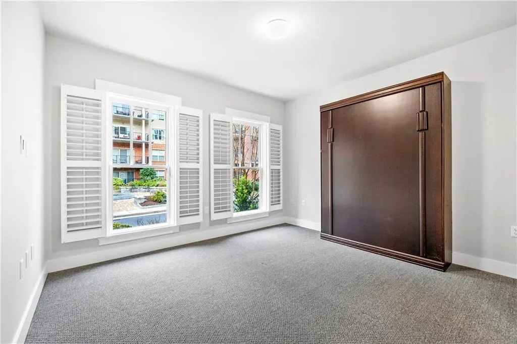 bedroom with carpet floors and baseboards