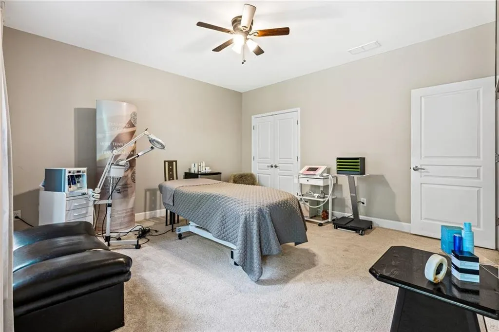 Bedroom featuring carpet floors, a closet, and ceiling fan