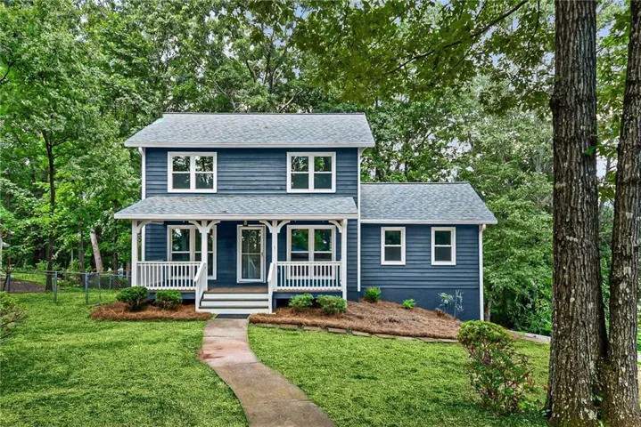 Two-story residence with blue siding and white trim