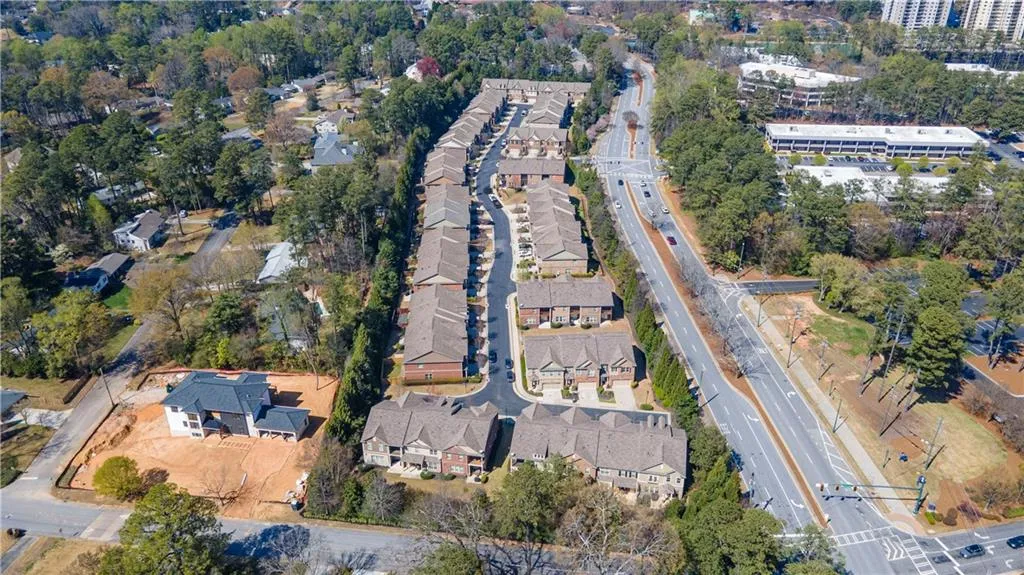 Aerial view of property's location with nearby suburban area