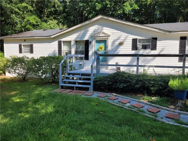 White siding exterior with a Light shingle roof