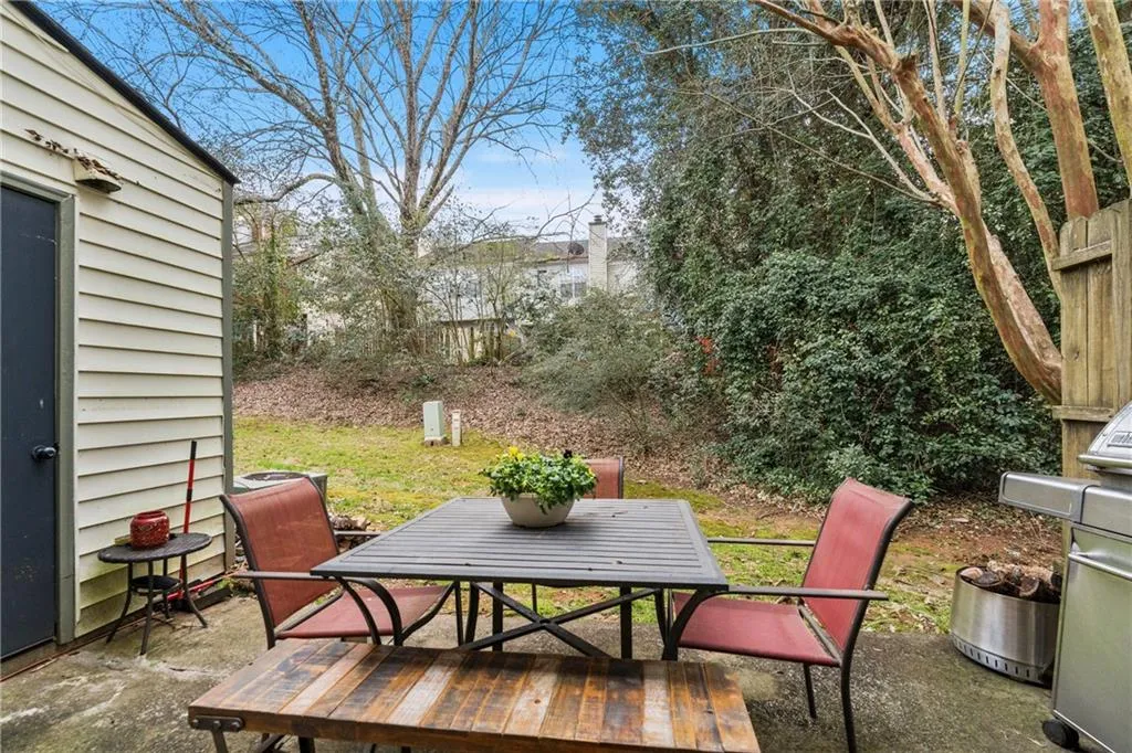 View of patio / terrace featuring outdoor dining area and a grill