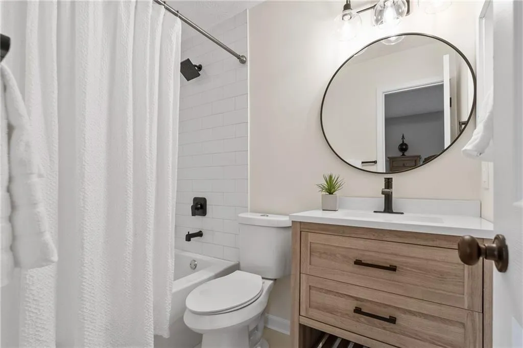 Bathroom featuring vanity and shower / tub combo