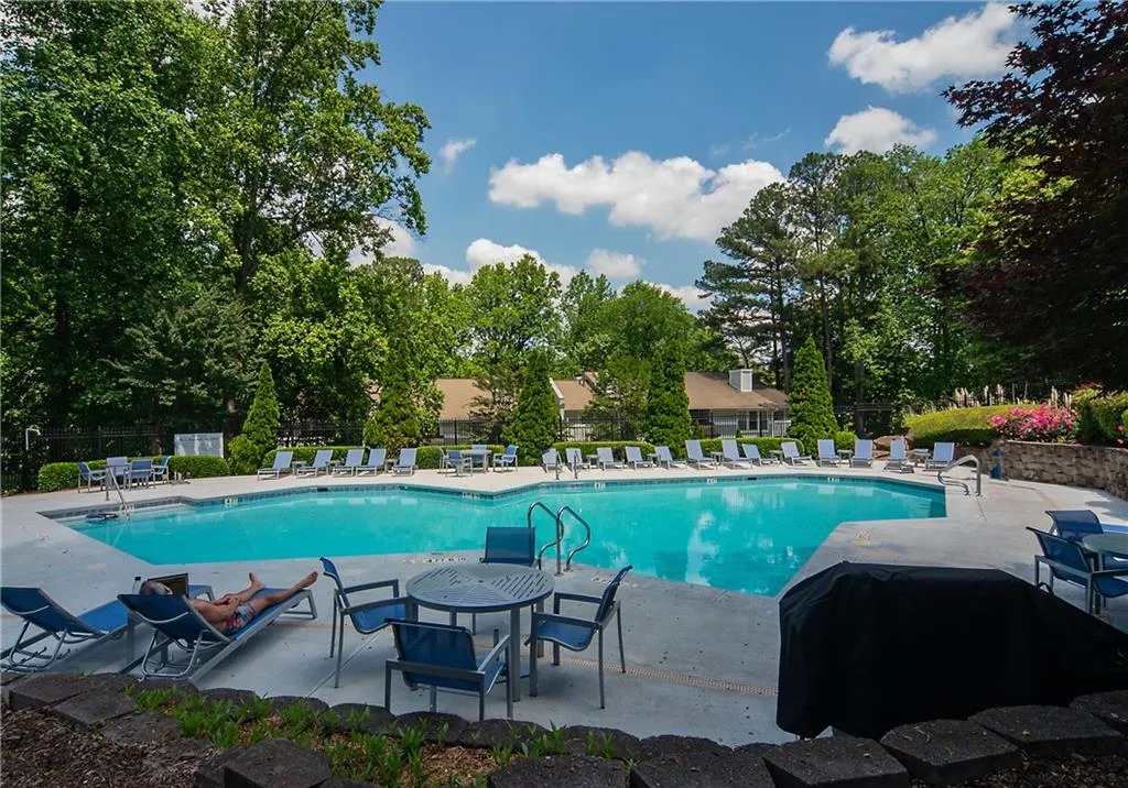 Community pool featuring a patio