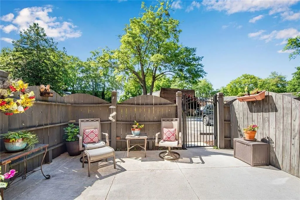 Backyard patio showing gate entry to parking lot