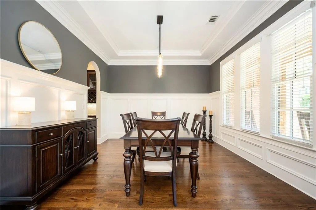 Dining room with wainscoting and trey ceiling