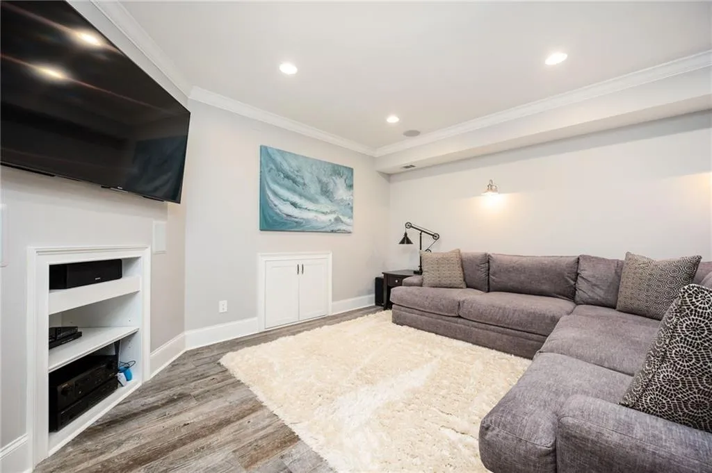 Basement entertainment area with built-in ceiling speakers throughout