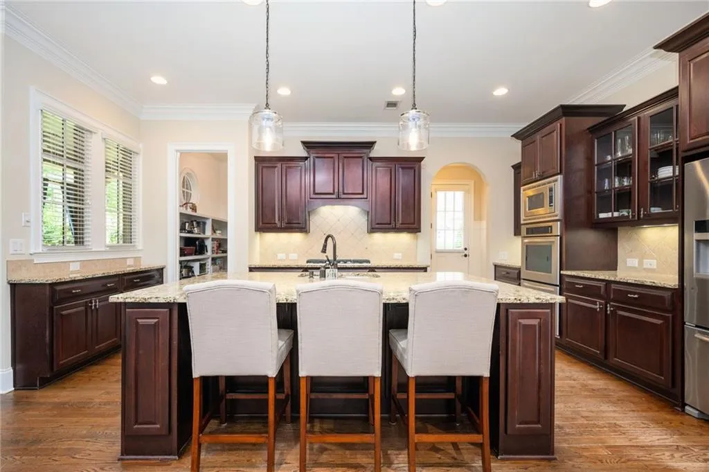 Kitchen with an oversized center island with sink