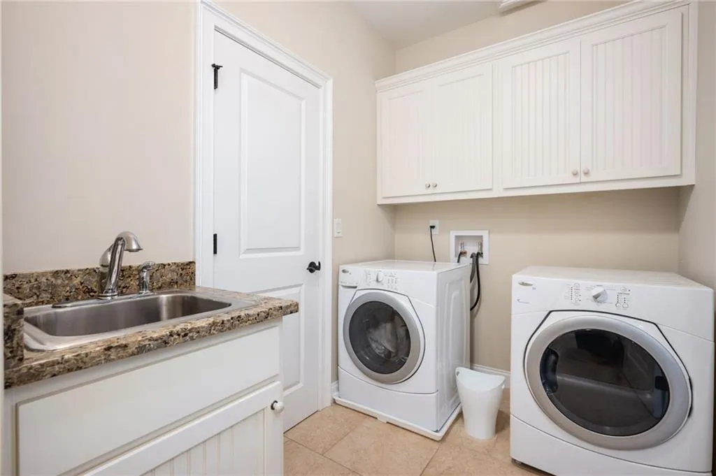 Laundry Room connected to both primary closet and upstairs hallway