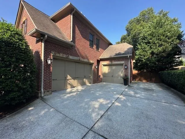 Parking for 4 cars with 3 garages and a parking pad