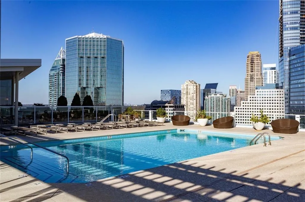 View of swimming pool featuring a patio area View of swimming pool featuring a patio area