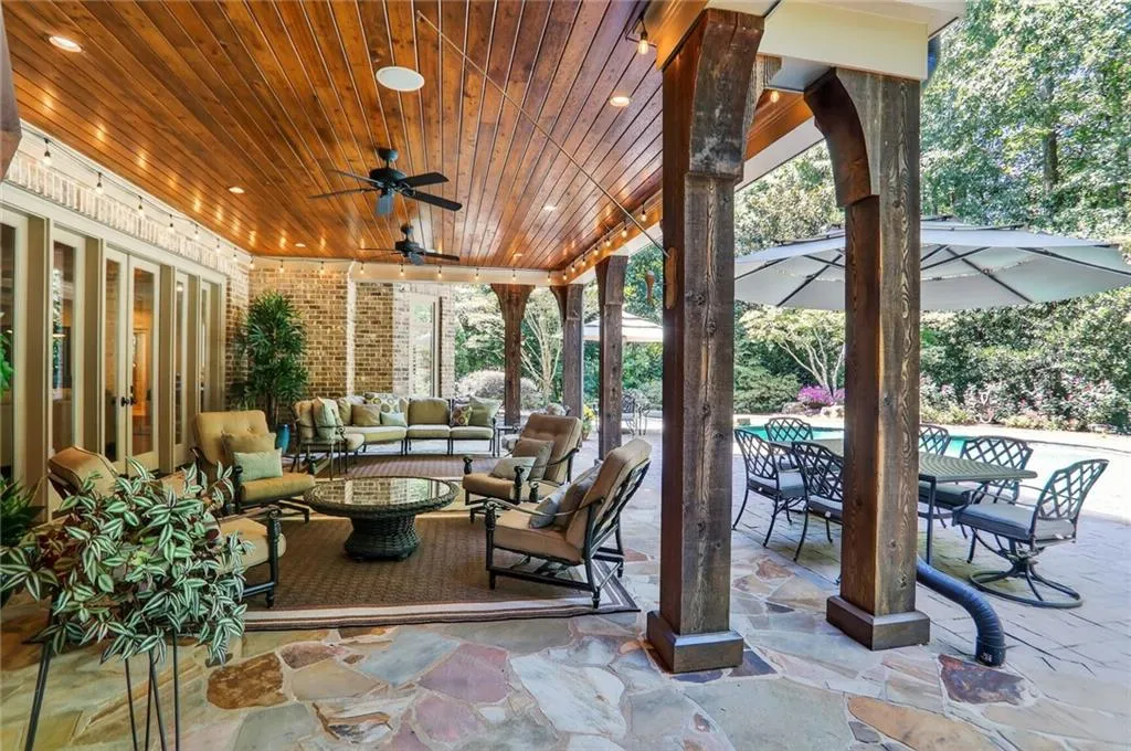 View of patio / terrace featuring an outdoor hangout area, outdoor dining space, a ceiling fan, and an outdoor pool