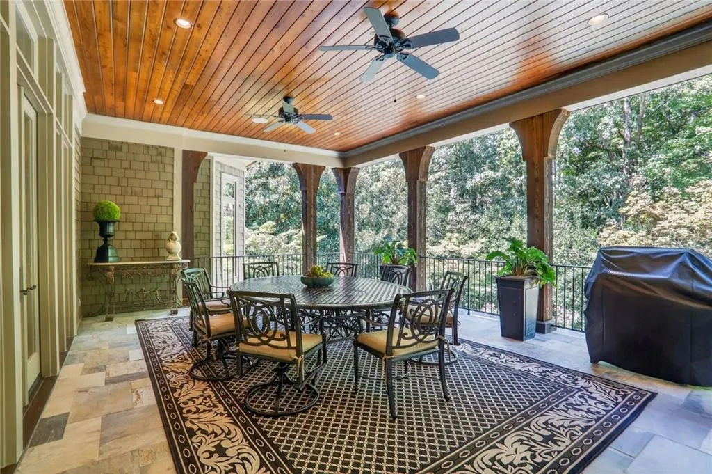 Sunroom with view of scattered trees