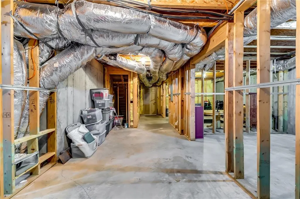 Unfinished portion of the basement consisting of three large rooms.