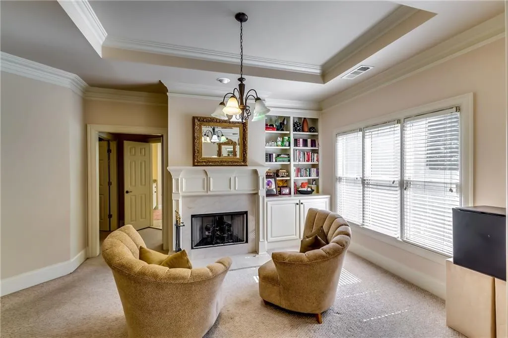 Sitting area with fireplace in the master suite.